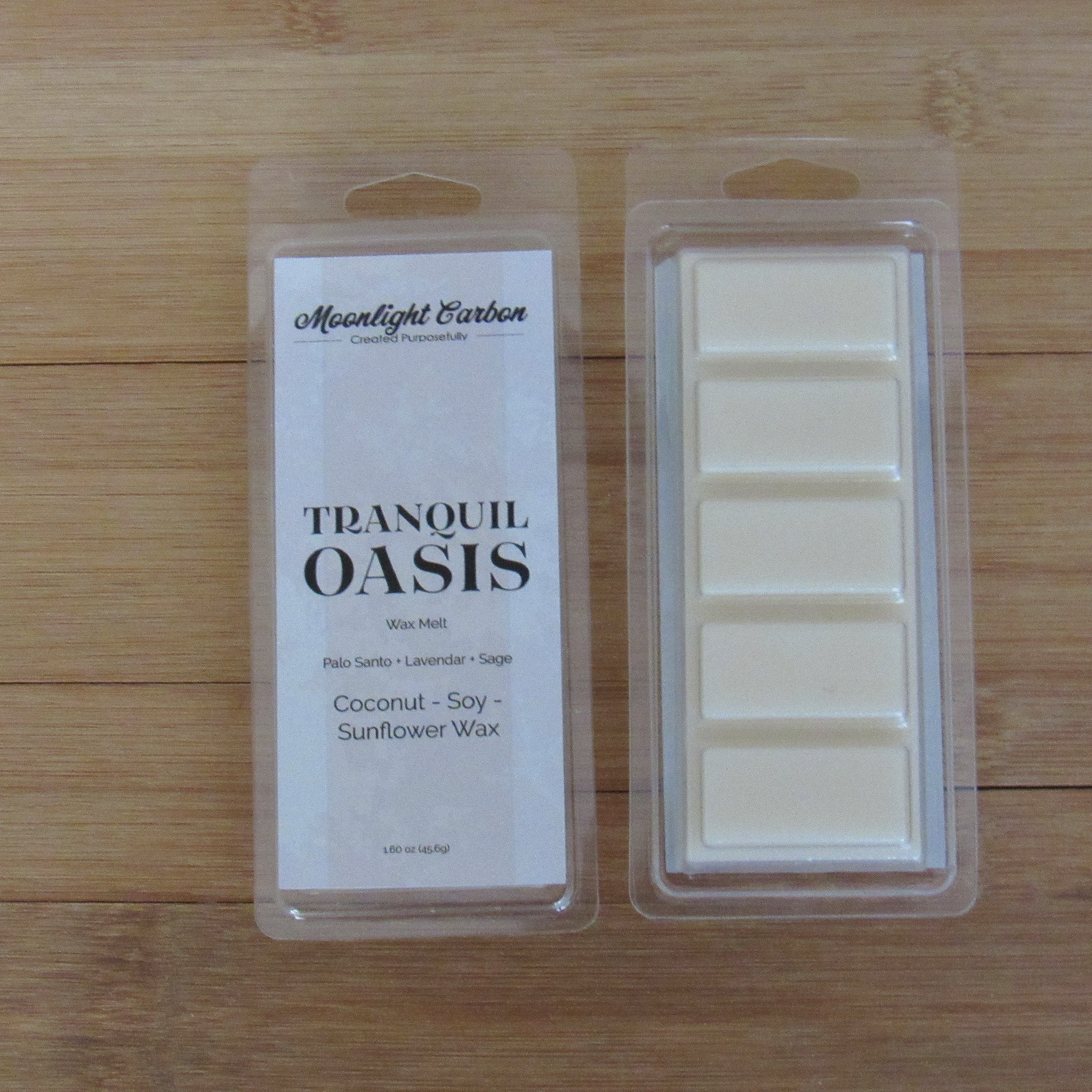 Wax melts in packaging with 'Moonlight Garden' label on a wooden surface. Shows back of packaging with wax melts divided into 5 parts.
