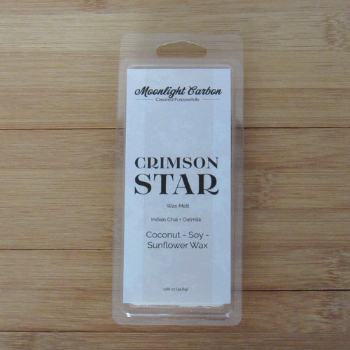 Wax melt packaging labeled 'Crimson Star' on a wooden surface