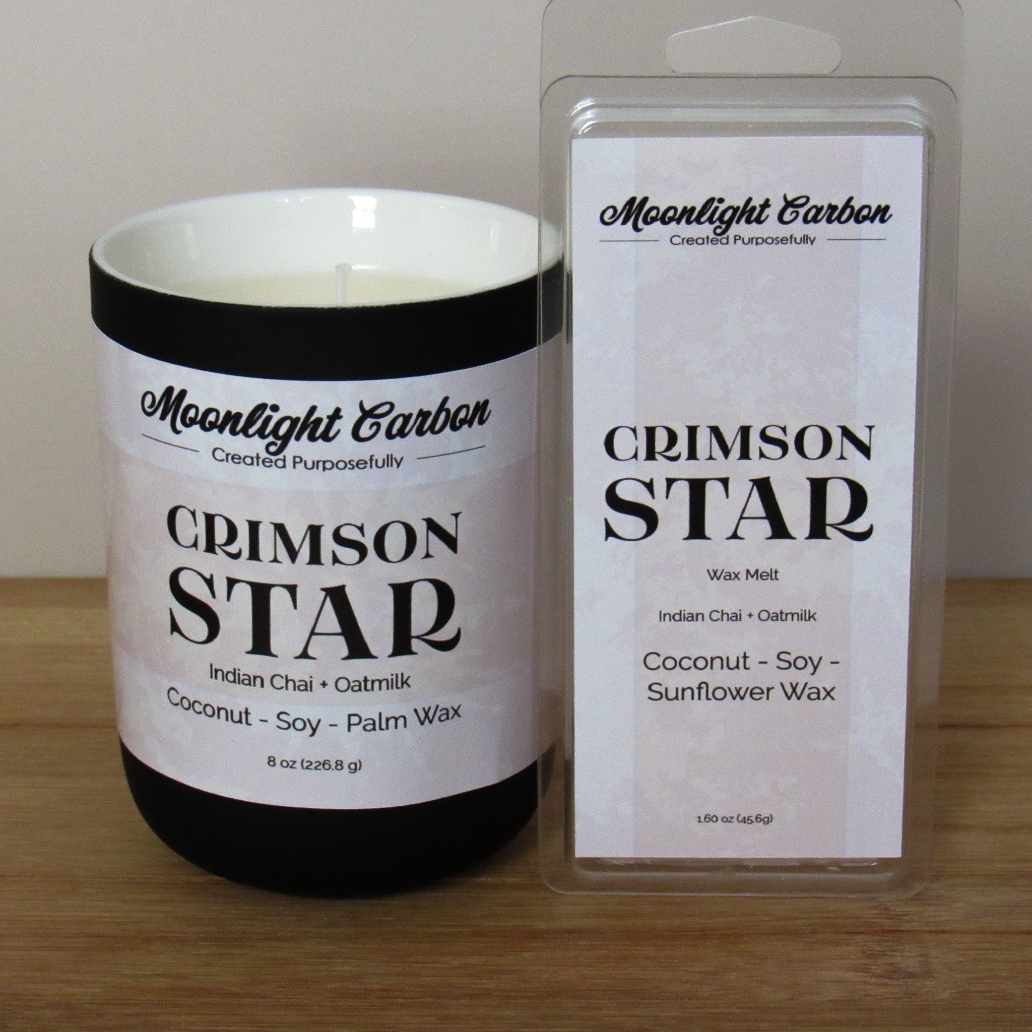 Candle and wax melt packaging of Crimson Star wax melt from Moonlight Carbon on a wooden surface.